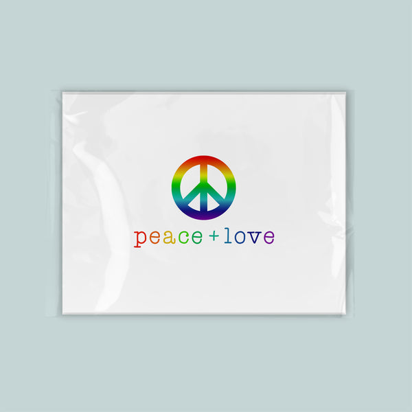 A white square with a peace sign and the text "peace + love" written below it.