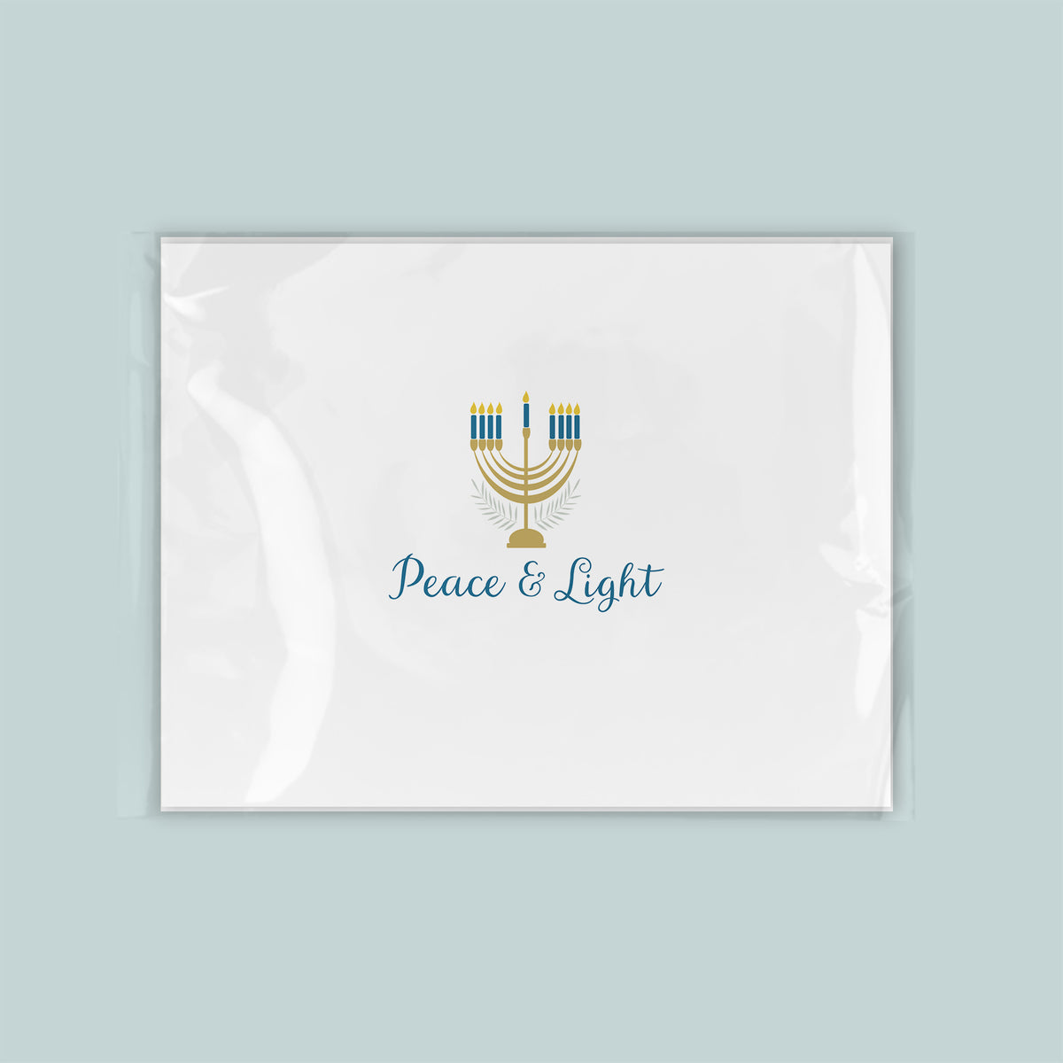 A white rectangular card with a stylized design of a menorah and the text "Peace & Light" printed on it.