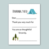 The image is a white card with a blue tent and pine trees on it. The card has a message that says 