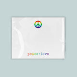 A white piece of paper with a peace symbol and the text 