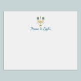 A white envelope with a graphic design featuring a menorah and the text 