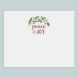 The image is a white card with a decorative wreath and the text 