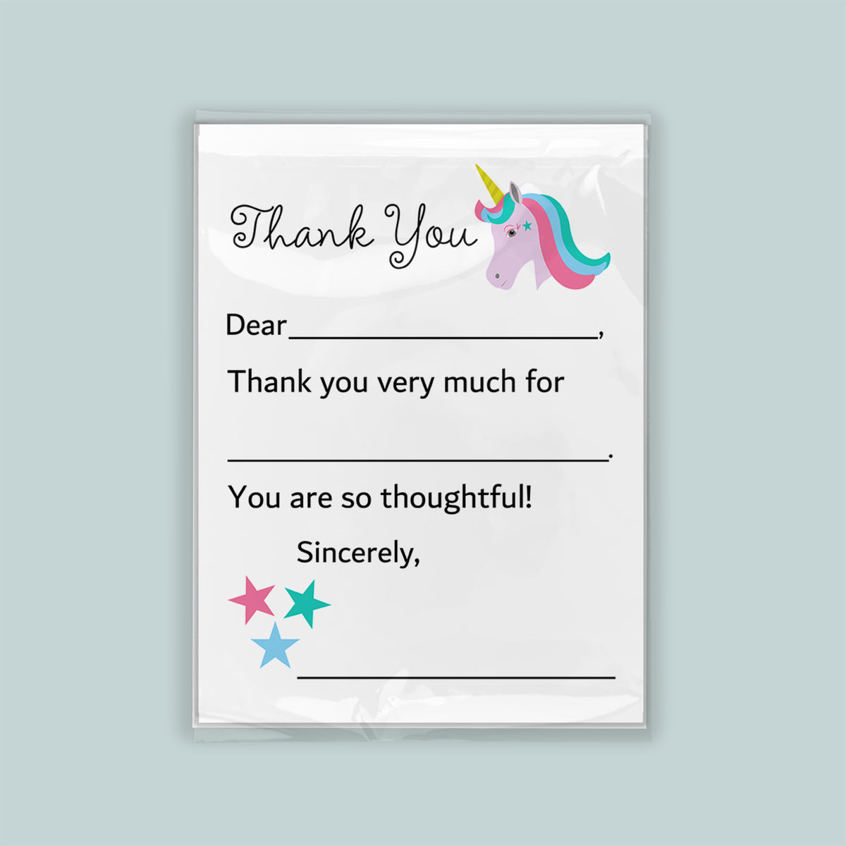 The image is a white thank you card with a unicorn illustration and stars. The card has a blank space for a recipient's name and a message expressing gratitude.
