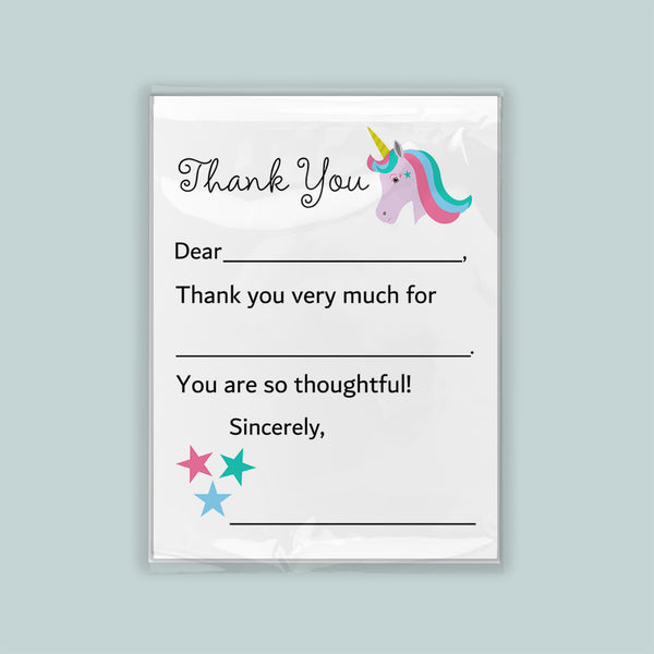 The image is a white thank you card with a unicorn illustration and stars. The card has a blank space for a recipient's name and a message expressing gratitude.