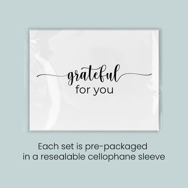 a set of pre-packaged items, each set in a resealable cellophane sleeve, with the text "grateful for you" printed on the front.