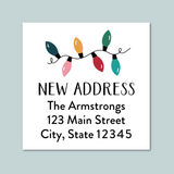a white address label with a festive design featuring colorful Christmas lights.