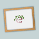 A white background with a brown frame containing a decorative wreath and the text 