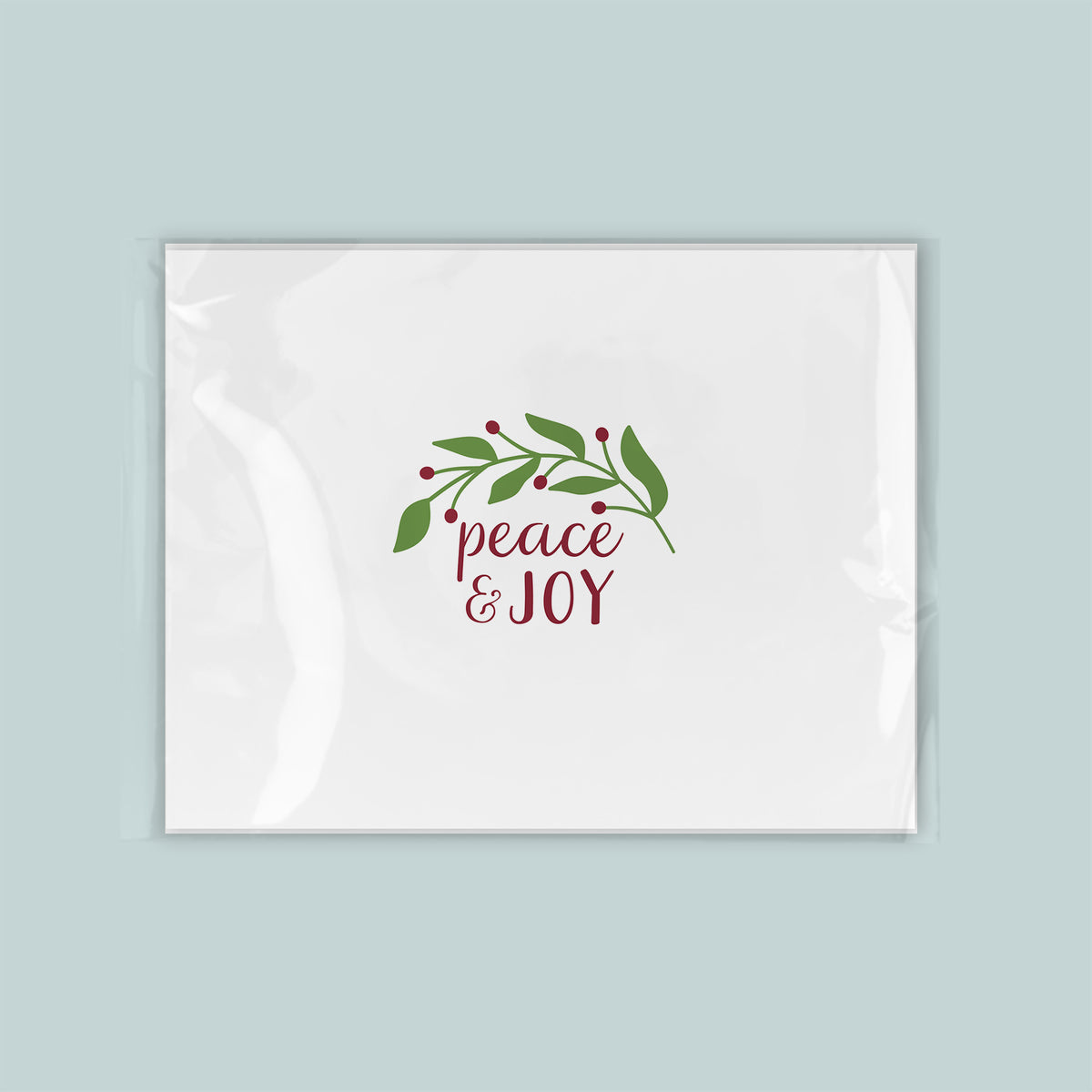 A white envelope with a holiday-themed design and text on it.