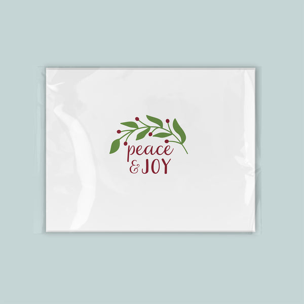 A white envelope with a holiday-themed design and text on it.