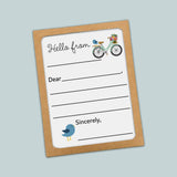 The image is a greeting card with a bicycle and a bird on it. The card has a blank space for a message and a blank space for a name.