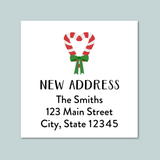 a white square with a red and white striped candy cane and a green ribbon tied around it, along with the text 