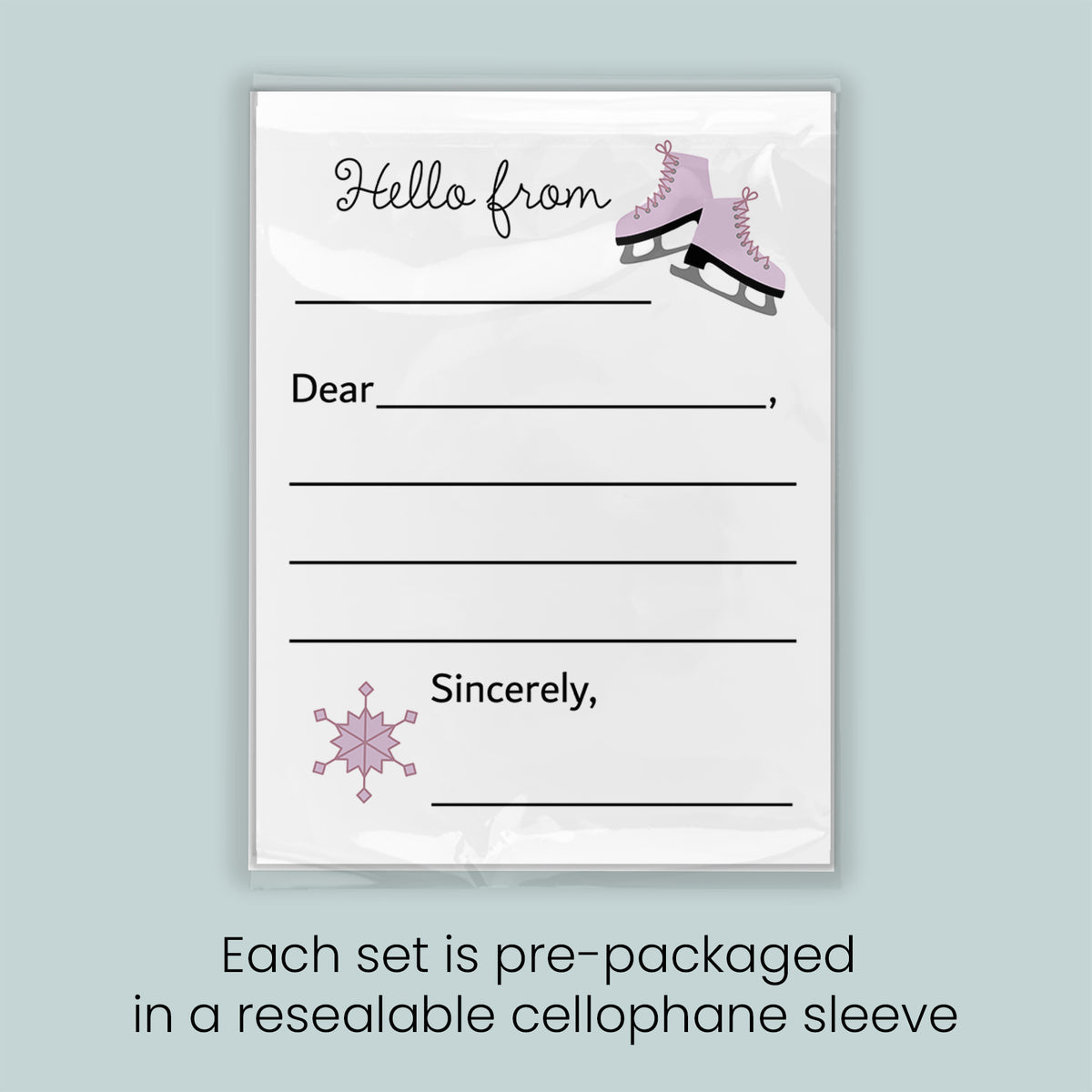 A pre-packaged letterhead set with a snowflake design and a pair of pink skates, indicating that each set is pre-packaged in a resealable cellophane sleeve.