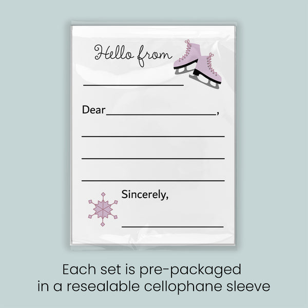 A pre-packaged letterhead set with a snowflake design and a pair of pink skates, indicating that each set is pre-packaged in a resealable cellophane sleeve.