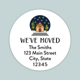 A white circular label with a winter scene and a house, along with the text 