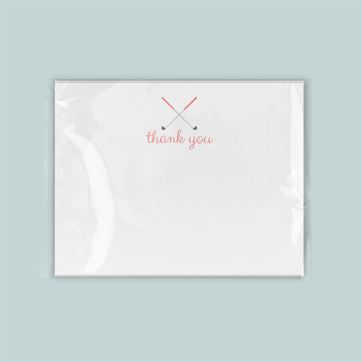 A white card with a red "thank you" message written on it.