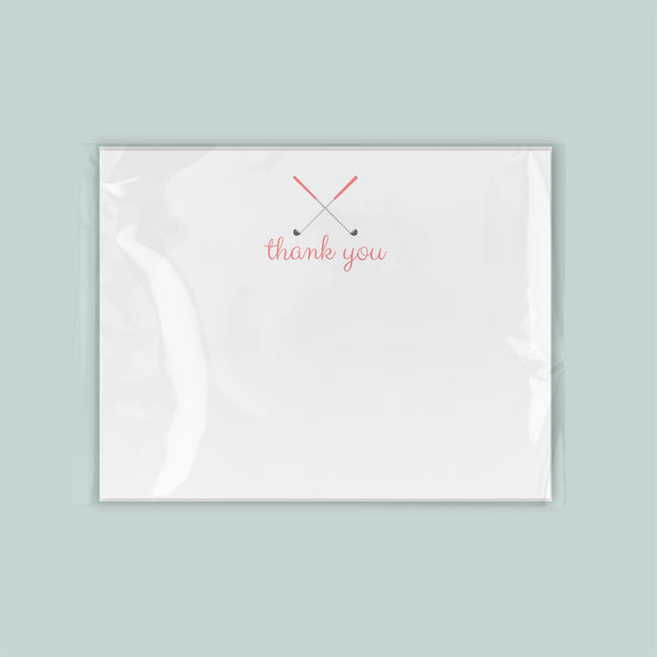 A white card with a red "thank you" message written on it.