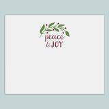 The image is a white card with a decorative wreath and the text 