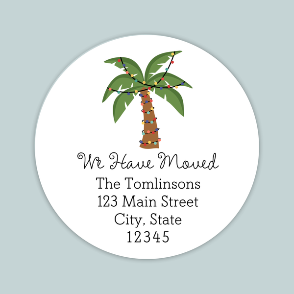 A white circular label with a palm tree illustration and text that reads "We Have Moved The Tomlinson's 123 Main Street City, State 12345".