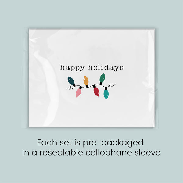 The image is a set of pre-packaged greeting cards, each set in a resealable cellophane sleeve.