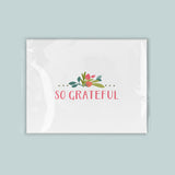 A white square with a floral design and the text 
