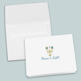 a white envelope with a printed design and text on it, and the text on the envelope reads 