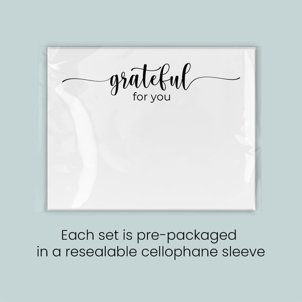 a set of pre-packaged items, each set in a resealable cellophane sleeve, with the text "grateful for you" written on the front of the items.