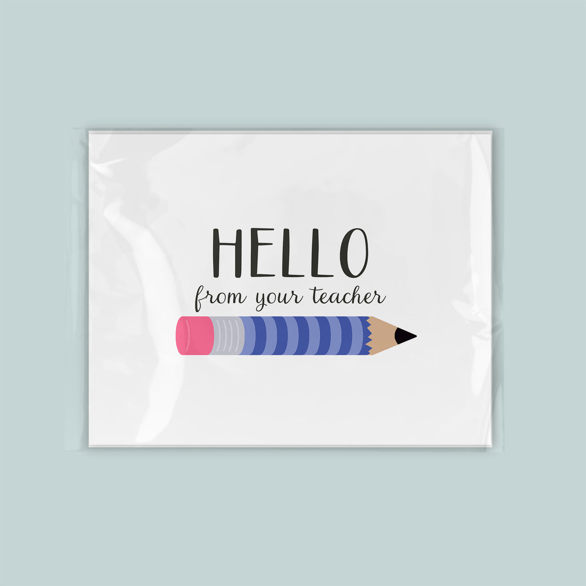 A greeting card with a pencil graphic and the text "Hello from your teacher" printed on it.