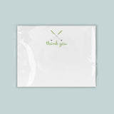 A white card with a green 
