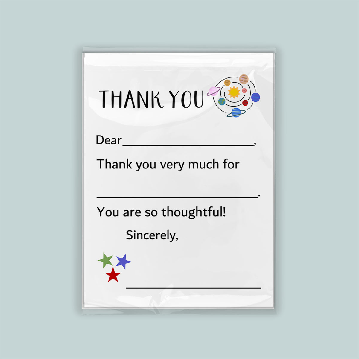 The image is a white thank you card with a space-themed design, including planets and stars. The card has a blank space for a recipient's name and a message expressing gratitude.