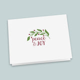 A white greeting card with a holiday-themed design and the text 
