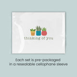 A set of pre-packaged greeting cards with a design featuring three potted plants and the text 