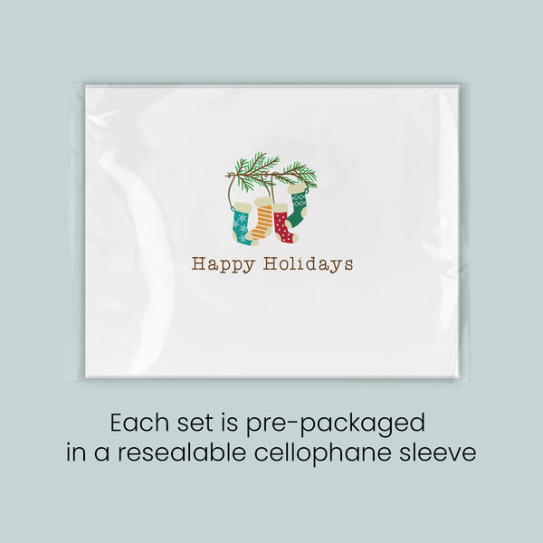 A set of pre-packaged greeting cards with a festive holiday design, each set in a re sealable cellophane sleeve.