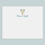 A white envelope with a graphic design featuring a menorah and the text 
