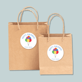 Two brown paper shopping bags with a 