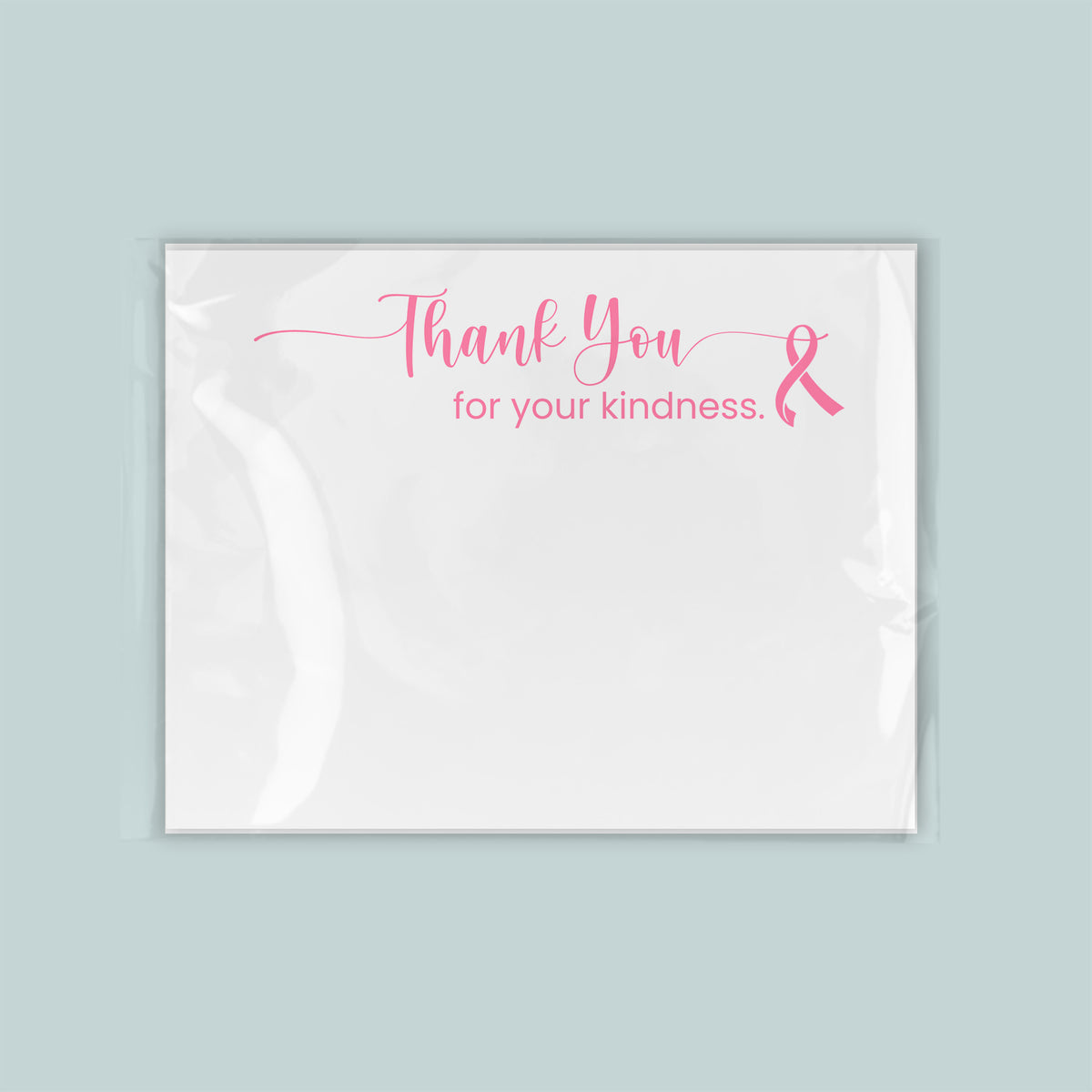 A white card with a pink ribbon symbol and the text "Thank You for your kindness."