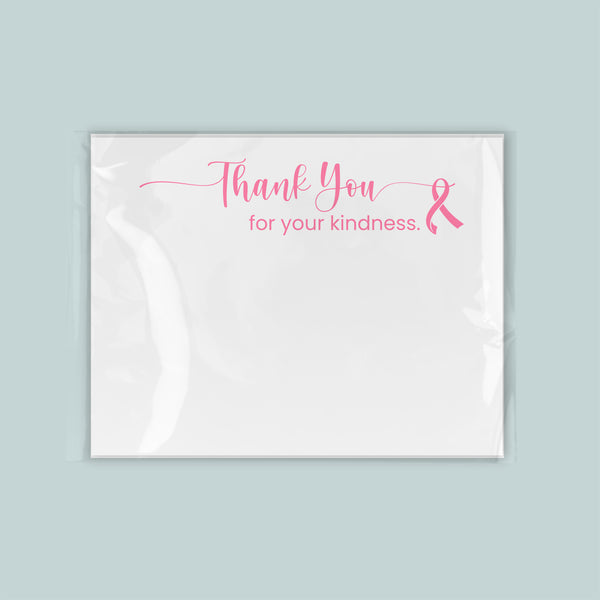 A white card with a pink ribbon symbol and the text "Thank You for your kindness."