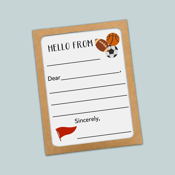 The image is a greeting card with a sports theme, featuring a basketball, soccer ball, and a flag. The card has a blank space for a message and a blank space for a name.