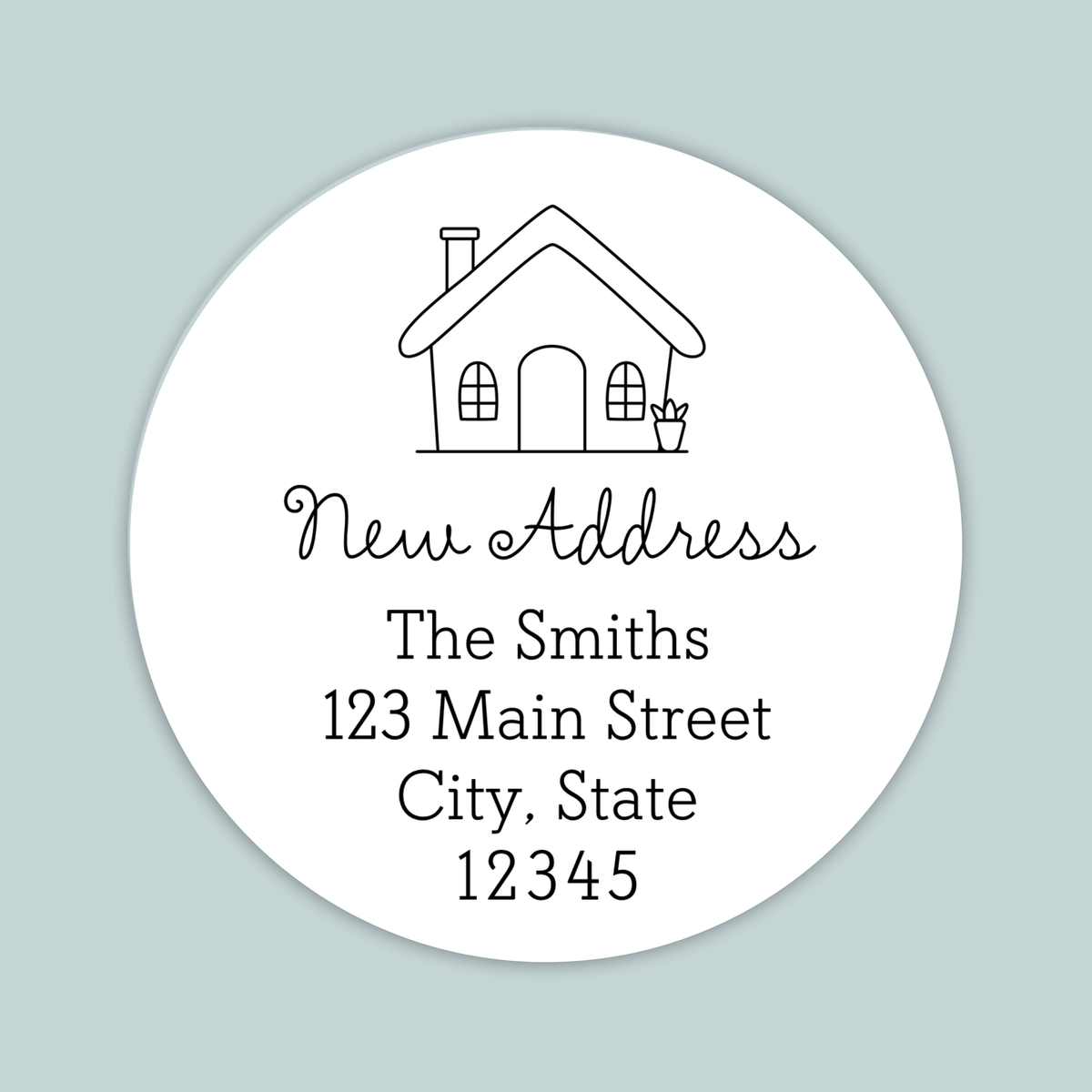 A white circular address label with a house illustration and text providing the address of The Smiths at 123 Main Street, City, State 12345.