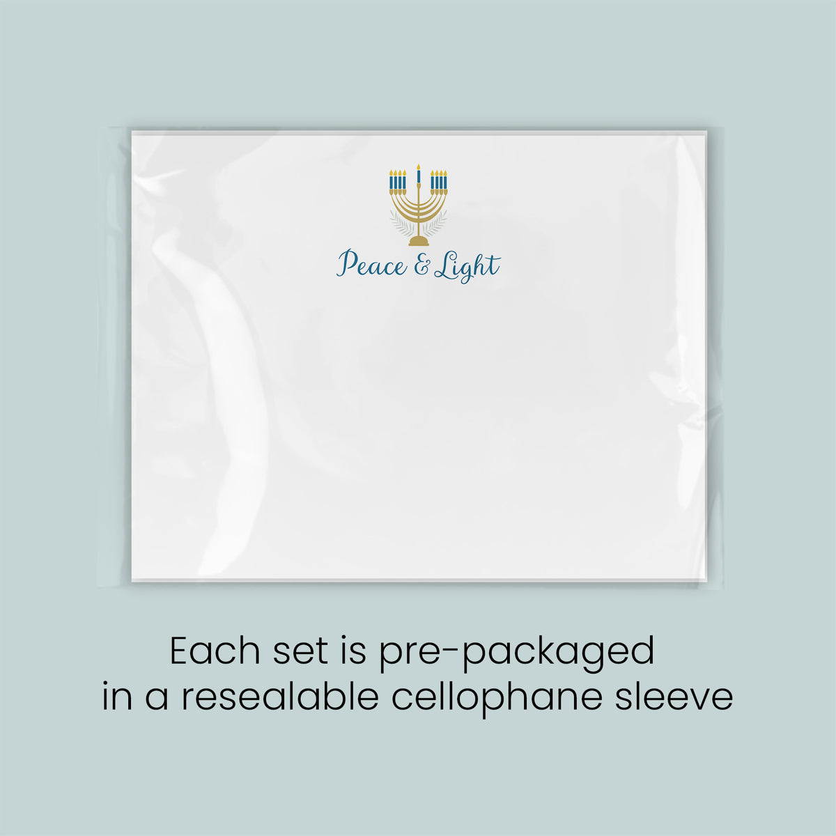 A white rectangular card with a gold and blue design and the text "Peace & Light" printed on it.