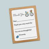 The image is a thank you card with a bicycle and a bird on it. The card has a blank space for a response and a message that says 