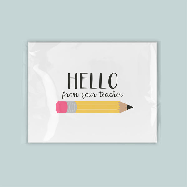 A greeting card with a pencil and the text "Hello from your teacher" printed on it.