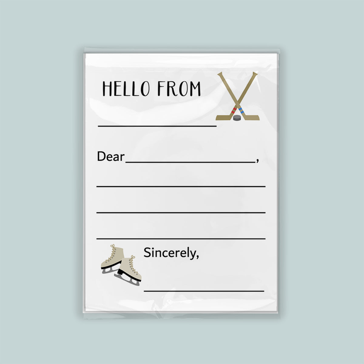 The image is a white envelope with a hockey stick and skates on the front, along with a blank greeting card space for a message.