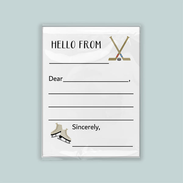 The image is a white envelope with a hockey stick and skates on the front, along with a blank greeting card space for a message.