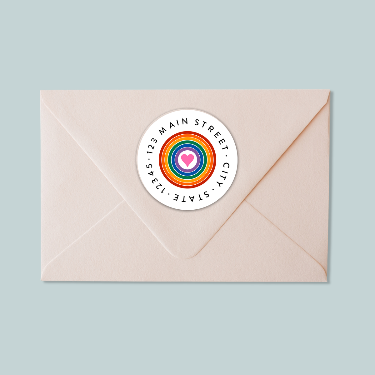 A white envelope with a colorful circular sticker on it.