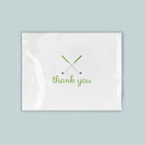 A white card with a green cursive text that says 