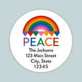 A white circular label with a rainbow graphic and the word 